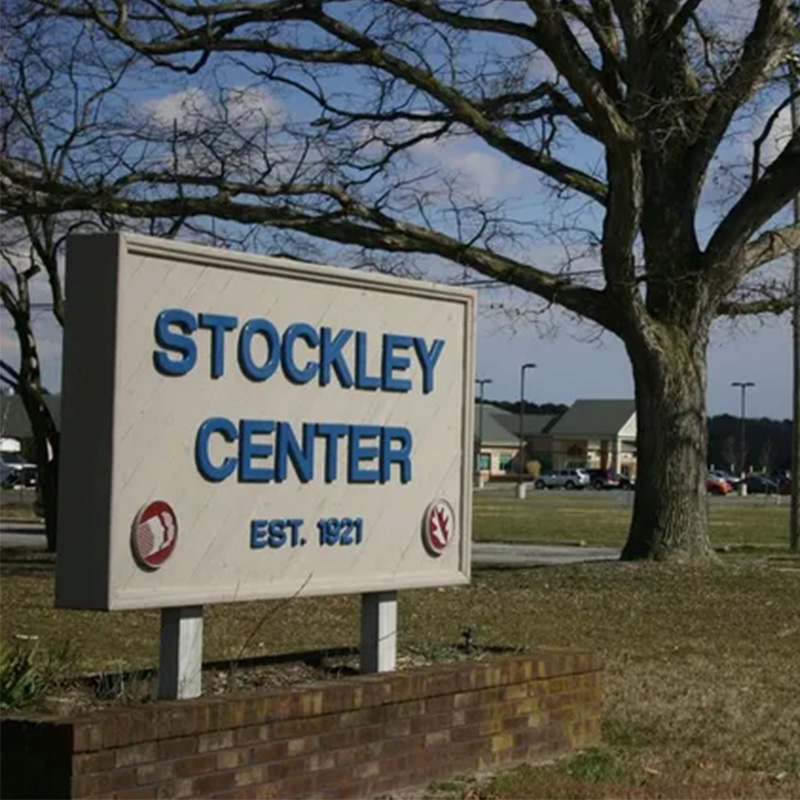 Outside Stockley Center on a bright day. Says est, 1921.